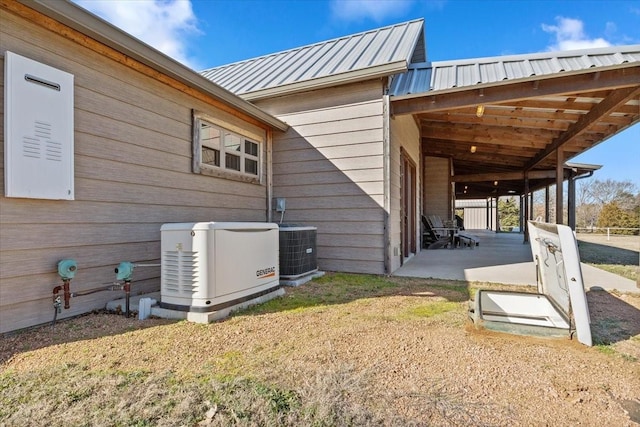 view of side of property featuring central AC unit