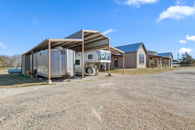 rear view of property with a carport