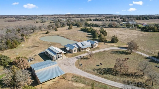 birds eye view of property featuring a rural view