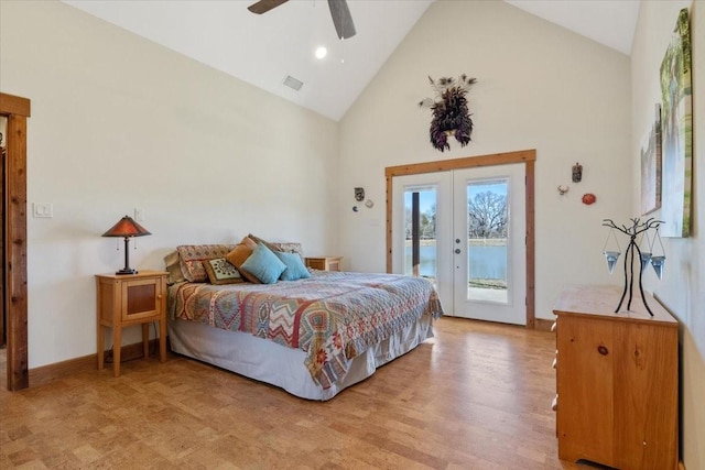 bedroom with light hardwood / wood-style flooring, ceiling fan, access to exterior, high vaulted ceiling, and french doors