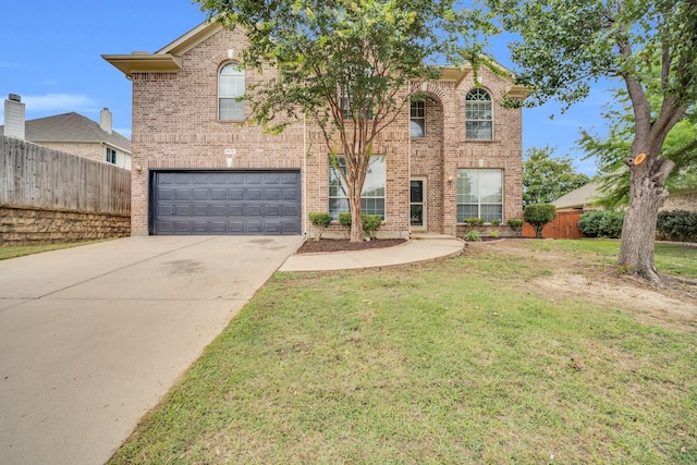 view of front facade with a garage and a front lawn