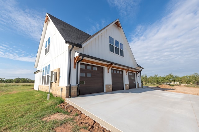 view of home's exterior with a garage and a yard