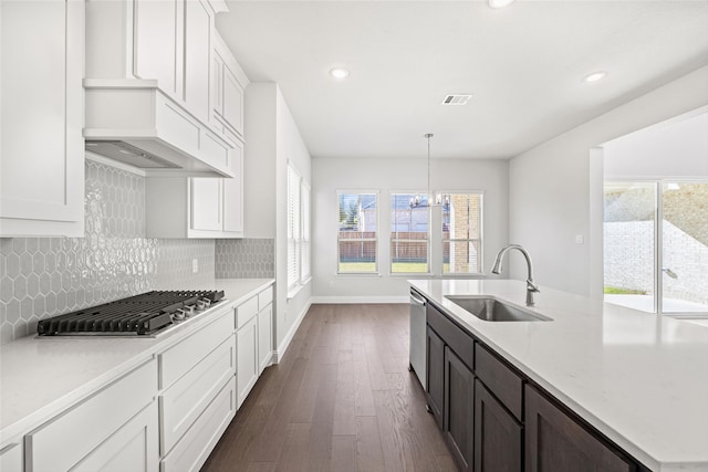 kitchen featuring pendant lighting, appliances with stainless steel finishes, sink, and a wealth of natural light