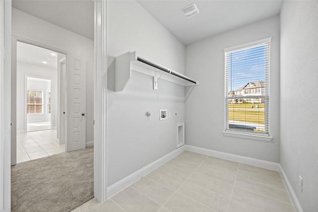 laundry room featuring hookup for an electric dryer, hookup for a gas dryer, light tile patterned flooring, and hookup for a washing machine