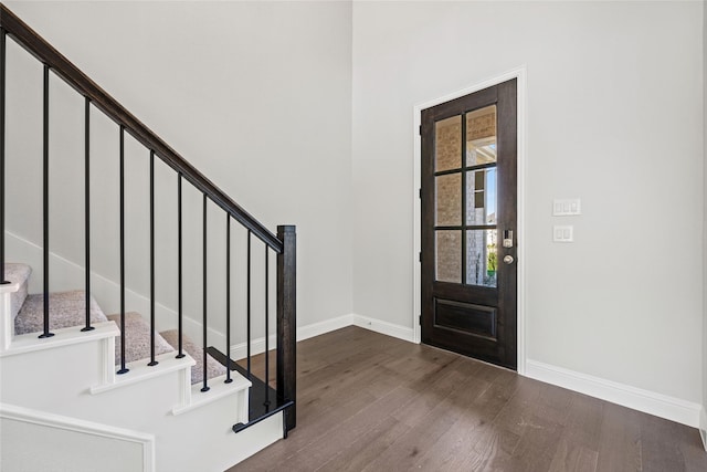 foyer with dark wood-type flooring