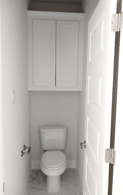 bathroom with tile floors and toilet