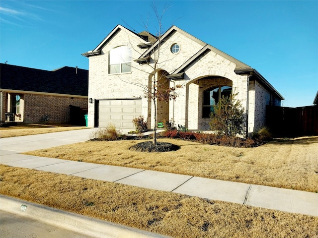 view of front facade with a front lawn and a garage