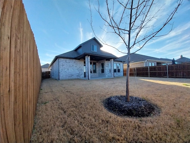 rear view of house featuring a patio