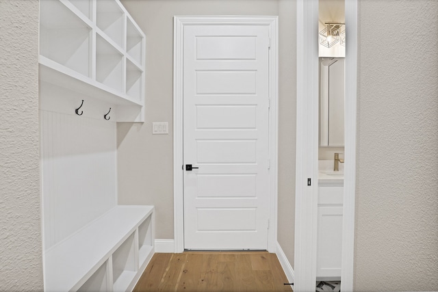 mudroom featuring light hardwood / wood-style floors and sink