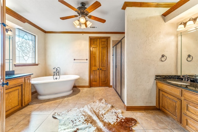 bathroom with shower with separate bathtub, tile patterned floors, ornamental molding, ceiling fan, and vanity