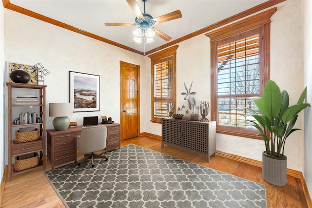 office area with ceiling fan, crown molding, and wood-type flooring