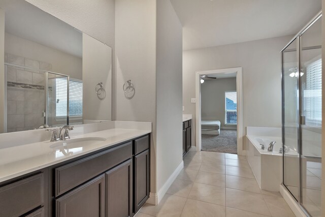 bathroom with tile patterned flooring, plenty of natural light, and vanity