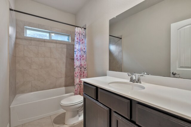 full bathroom featuring tile patterned flooring, vanity, shower / bathtub combination with curtain, and toilet