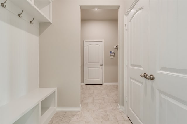 mudroom with light tile patterned floors