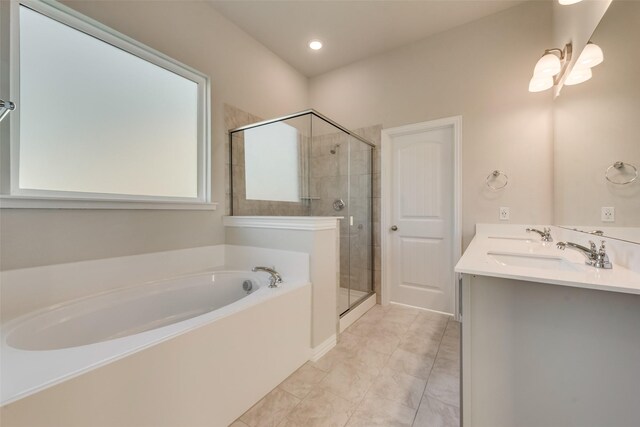 bathroom with tile patterned floors, separate shower and tub, and vanity