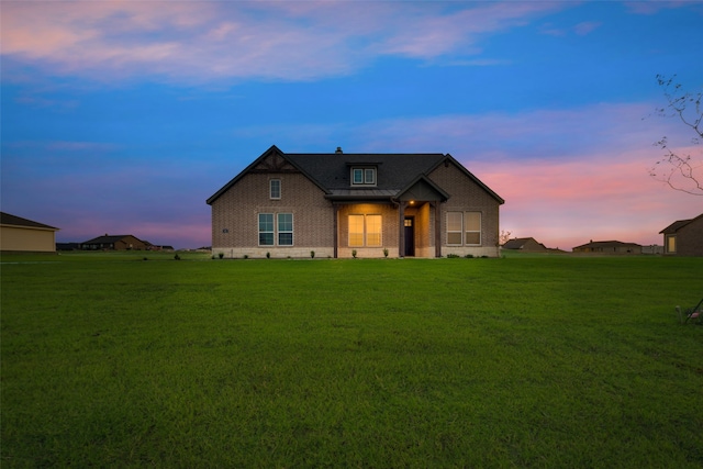 craftsman-style home with a yard