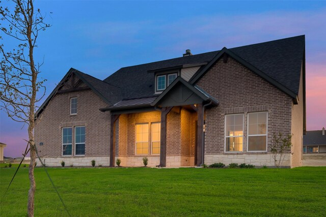 view of front of house with a lawn