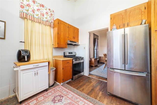 kitchen featuring stainless steel appliances and hardwood / wood-style flooring