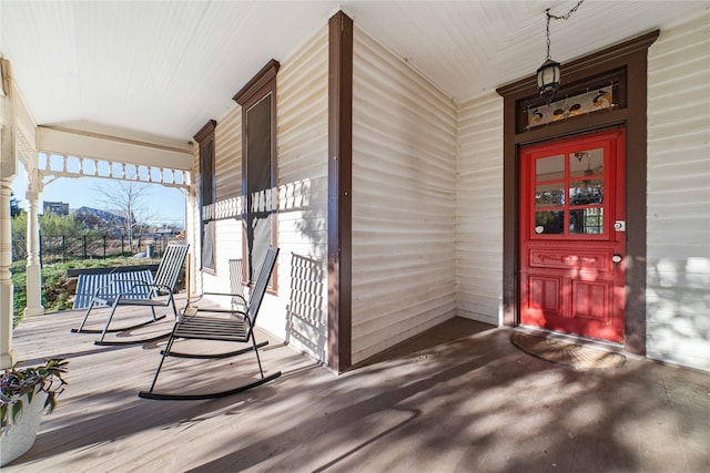 view of exterior entry with covered porch