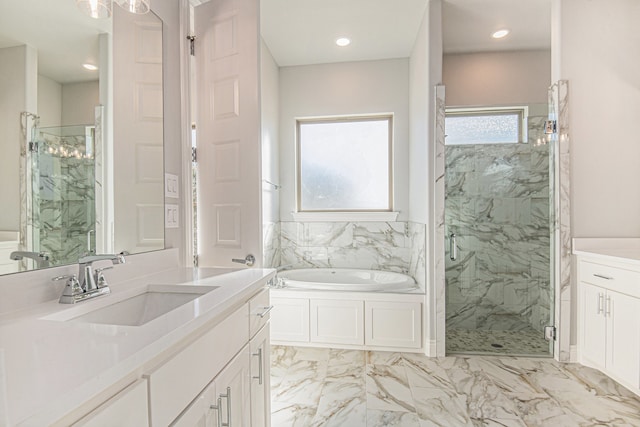 bathroom featuring independent shower and bath and vanity