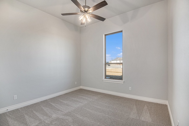 spare room with carpet floors and ceiling fan