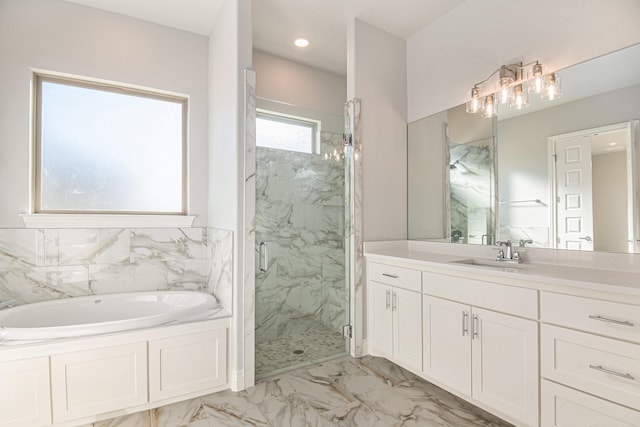 bathroom featuring vanity and shower with separate bathtub