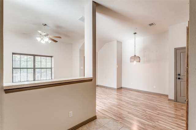 unfurnished room featuring ceiling fan and light wood-type flooring