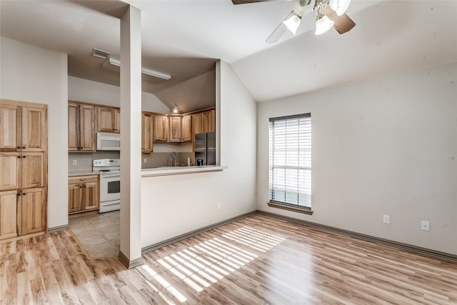 kitchen with light wood-type flooring, sink, lofted ceiling, white appliances, and ceiling fan