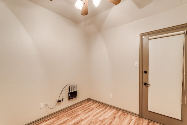 empty room featuring light wood-type flooring and ceiling fan