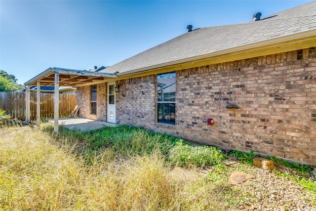 back of house with a patio