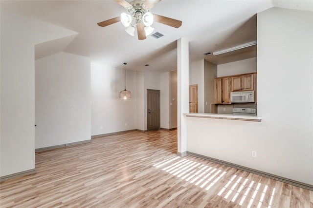 unfurnished living room with ceiling fan, vaulted ceiling, and light hardwood / wood-style floors