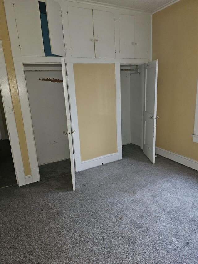 unfurnished bedroom featuring light carpet and baseboards