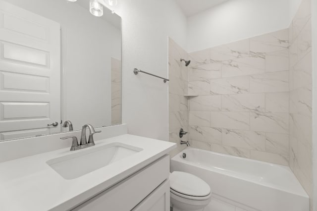 full bathroom with toilet, tiled shower / bath, and vanity