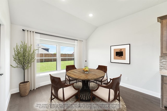 dining area featuring dark wood-type flooring, recessed lighting, vaulted ceiling, and baseboards