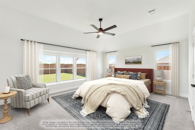 bedroom featuring multiple windows, carpet flooring, and visible vents