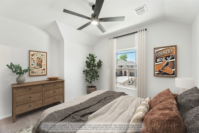 bedroom with lofted ceiling, carpet flooring, visible vents, and a ceiling fan