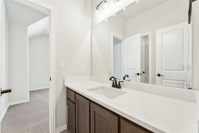 bathroom with vanity and baseboards