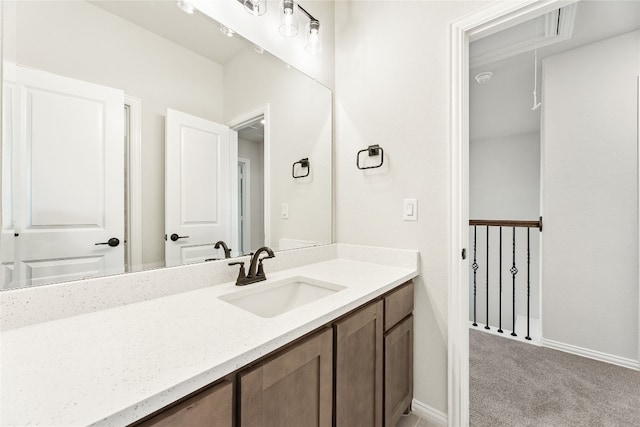 bathroom with baseboards and vanity