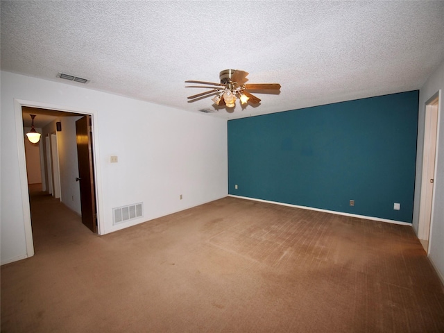1505 S Rodgers Dr, Graham, TX 76450 - empty room with carpet floors, a ceiling fan, and a textured ceiling
