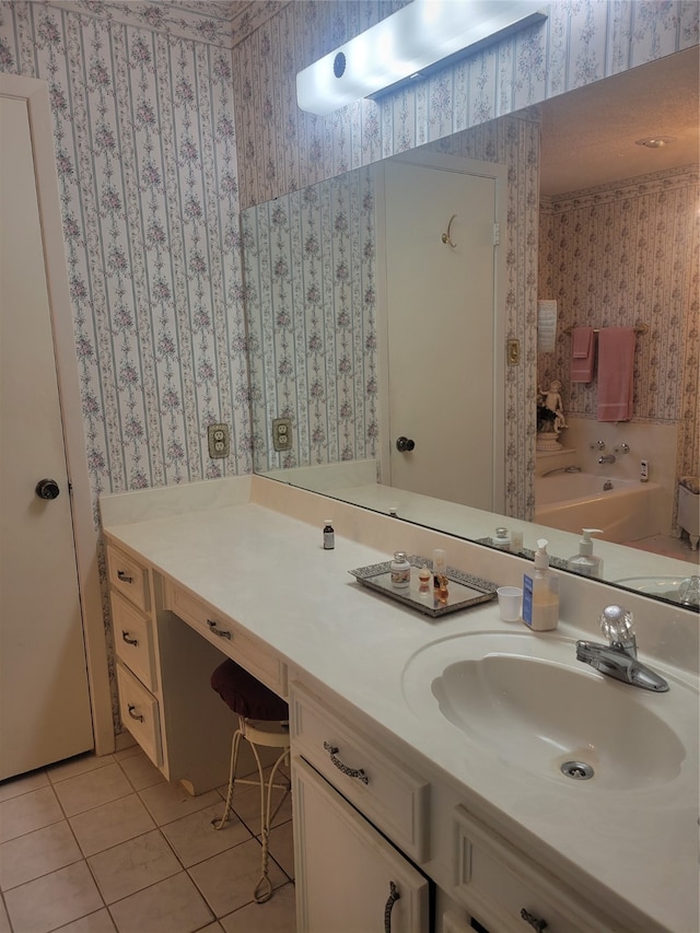 bathroom with tile patterned floors and vanity