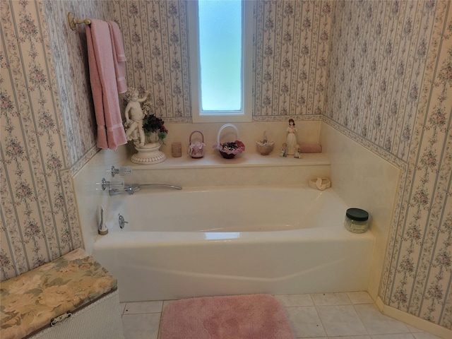 full bathroom with tile patterned flooring, a bath, and wallpapered walls