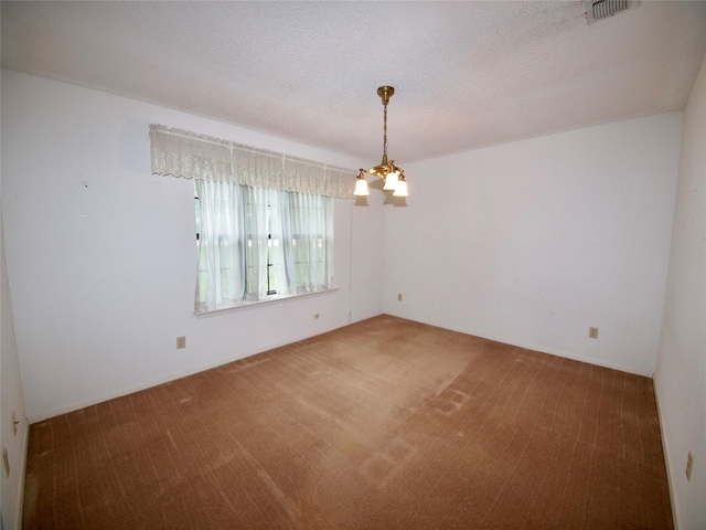1505 S Rodgers Dr, Graham, TX 76450 - carpeted empty room featuring a chandelier and a textured ceiling