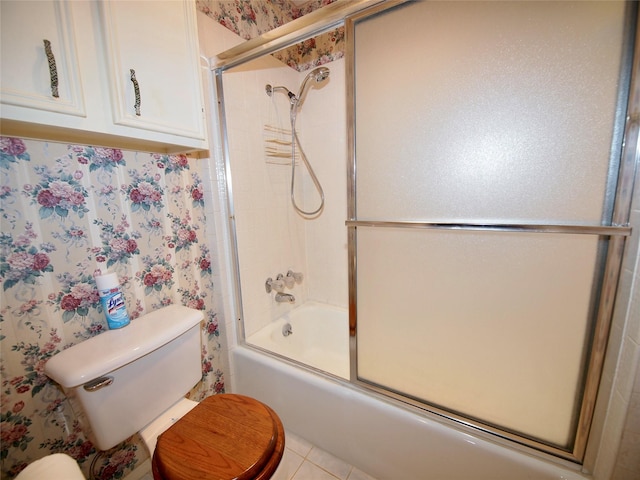 1505 S Rodgers Dr, Graham, TX 76450 - bathroom with toilet, shower / bath combination with glass door, and wallpapered walls