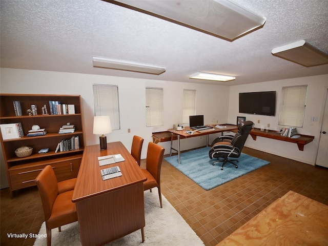 1505 S Rodgers Dr, Graham, TX 76450 - carpeted office featuring a textured ceiling