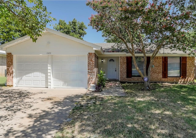 ranch-style house featuring a front yard and a garage