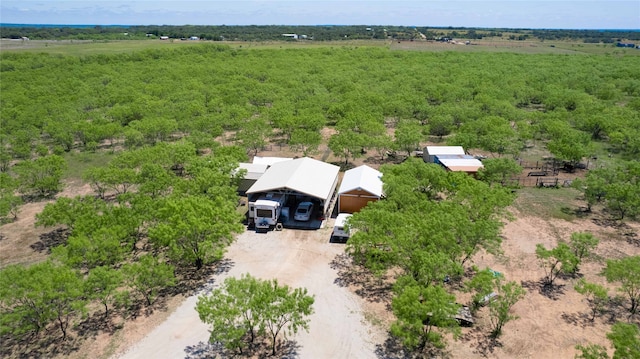 birds eye view of property with a rural view