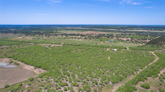 birds eye view of property with a rural view