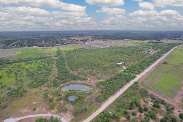 birds eye view of property with a water view and a rural view