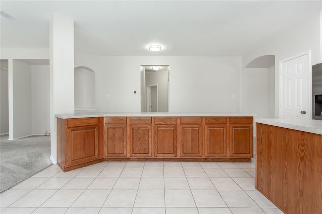 kitchen featuring light colored carpet