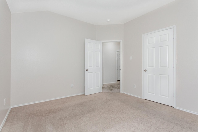 unfurnished bedroom featuring light carpet